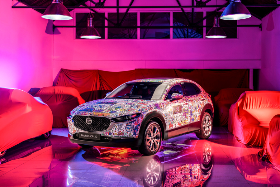 Doodle artist Luke Crump and CarFest attendees create Mazda CX-30 art car