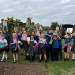 LOCAL SCHOOL CHILDREN AND RETIREES SHARE THEIR FAVOURITE BOOKS DURING AN AFTERNOON TO CELEBRATE GRANDPARENTS DAY IN STOW-ON-THE-WOLD